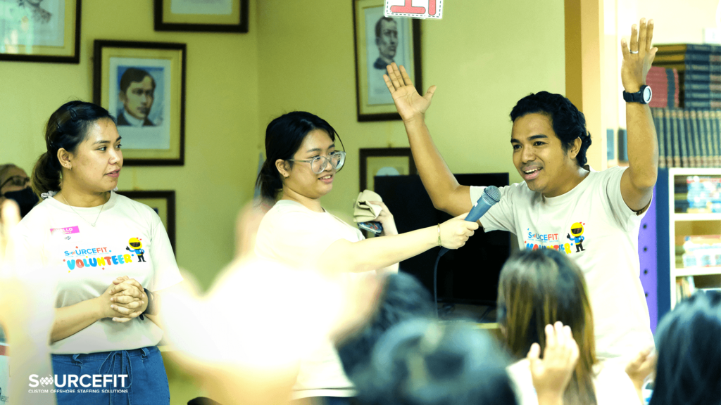 Sourcefit staff playing with the students