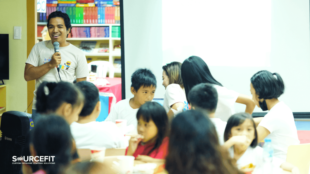 Teacher smiling while teaching students