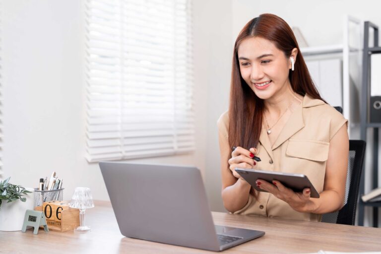 Asian woman wearing earphones — Top BPO Solutions | Outsourcing Services In The Philippines
