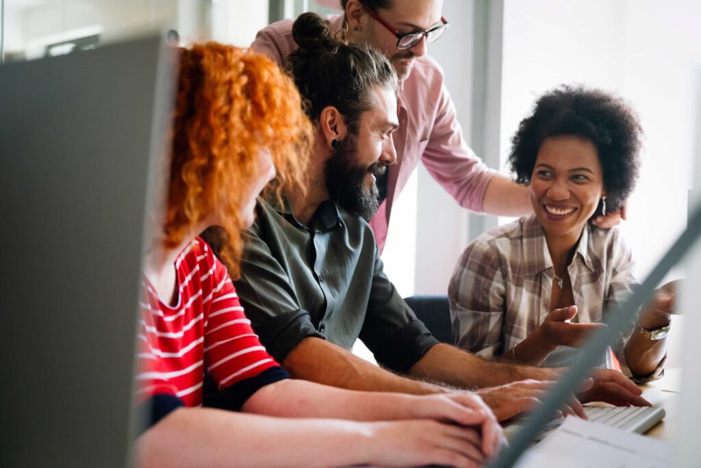 Happy team working — Top BPO Solutions | Outsourcing Services In The Philippines
