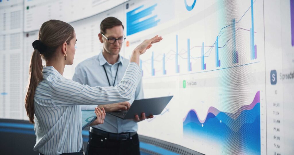 Woman and man discussing work — Top BPO Solutions | Outsourcing Services In The Philippines