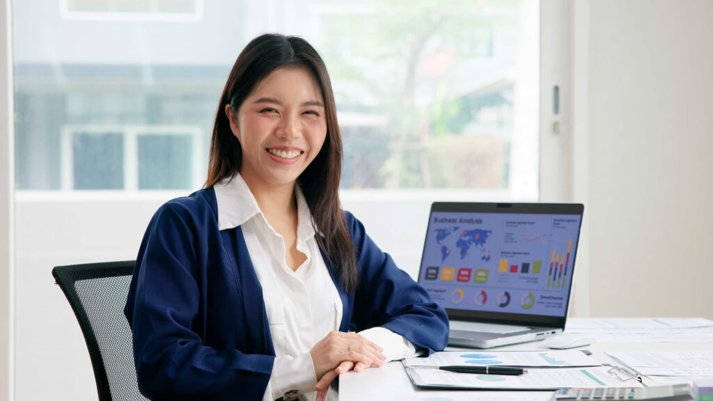 Smiling agent wearing blue coat — Top BPO Solutions | Outsourcing Services In The Philippines
