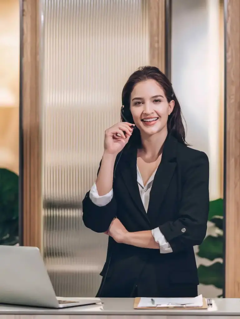 Woman wearing black coat and smiling — Top BPO Solutions | Outsourcing Services In The Philippines