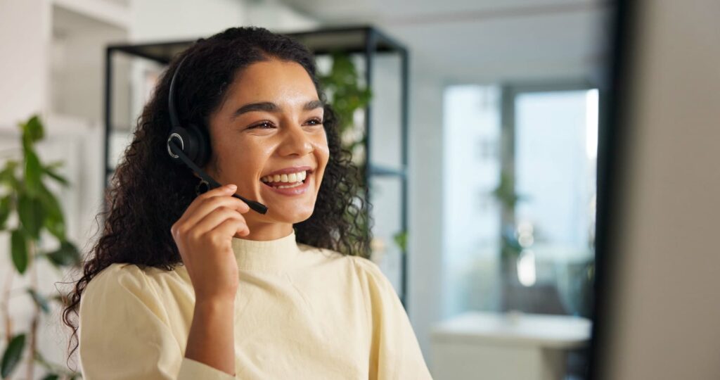Lady on call using a headset — Top BPO Solutions | Outsourcing Services In The Philippines