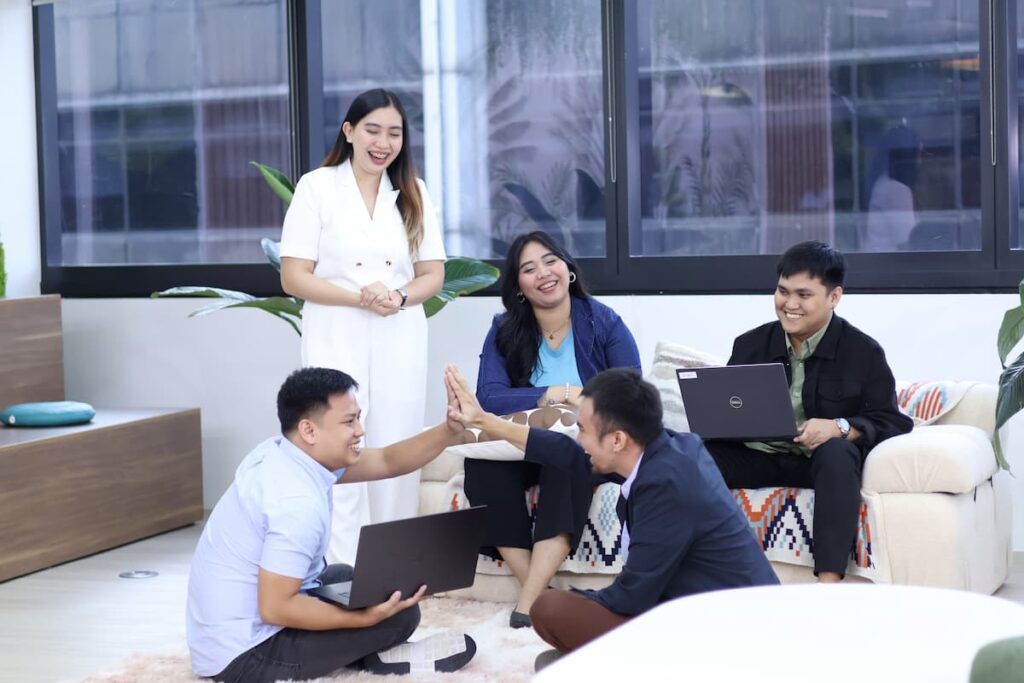 Happy team discussion — Business process outsourcing & offshore staffing | Sourcefit