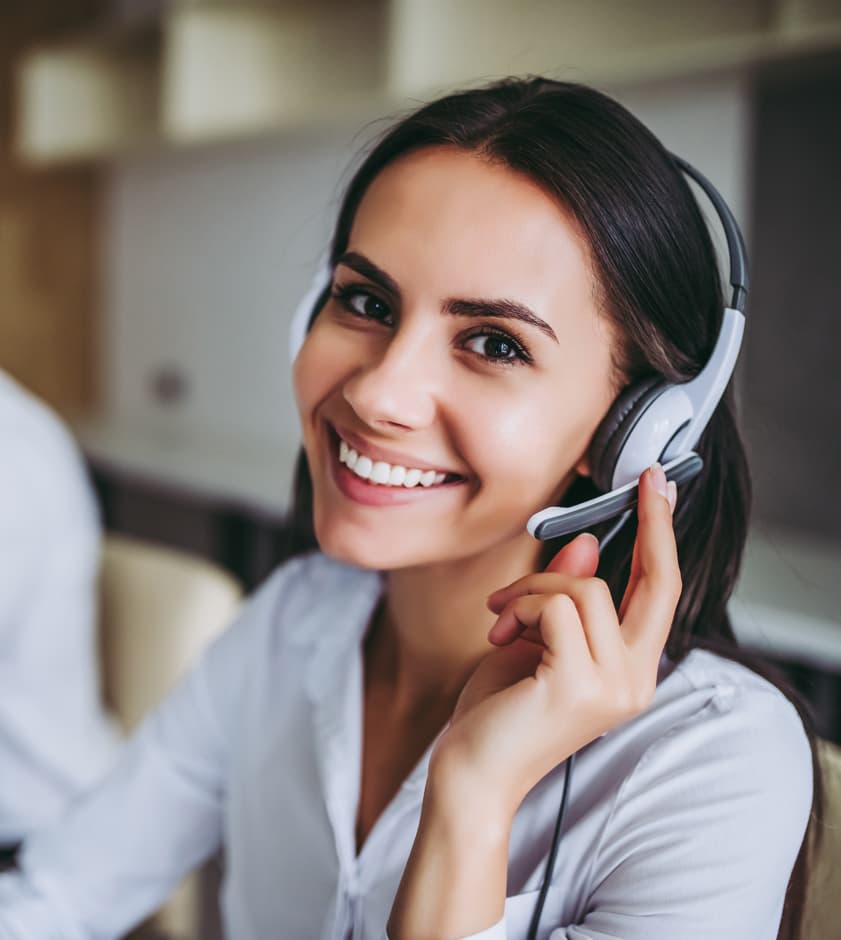 Woman agent wearing headphones — Business process outsourcing & offshore staffing | Sourcefit