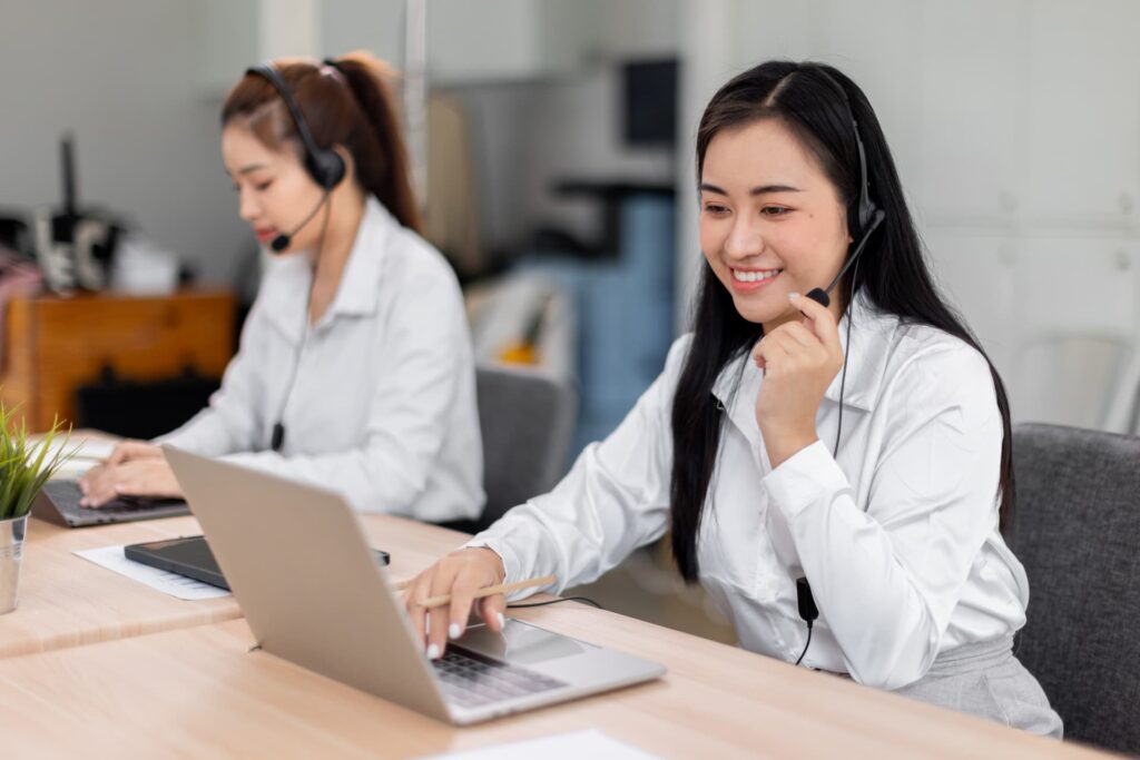 Woman agent speaking with a client online — Business process outsourcing & offshore staffing | Sourcefit