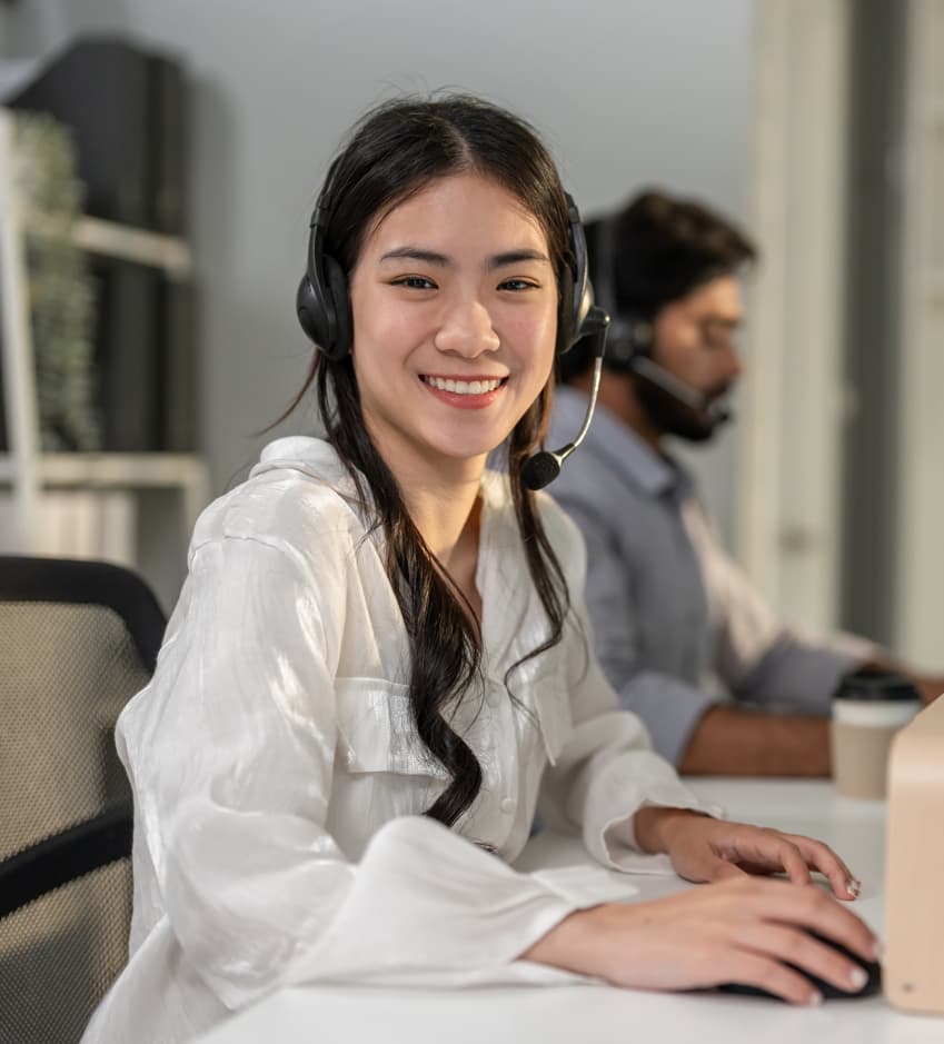 Asian customer service agent smiling — Business process outsourcing & offshore staffing | Sourcefit