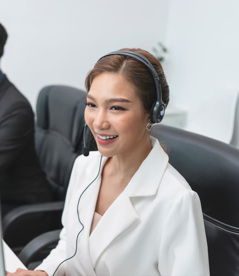 Lady wearing headset at work — Business process outsourcing & offshore staffing | Sourcefit