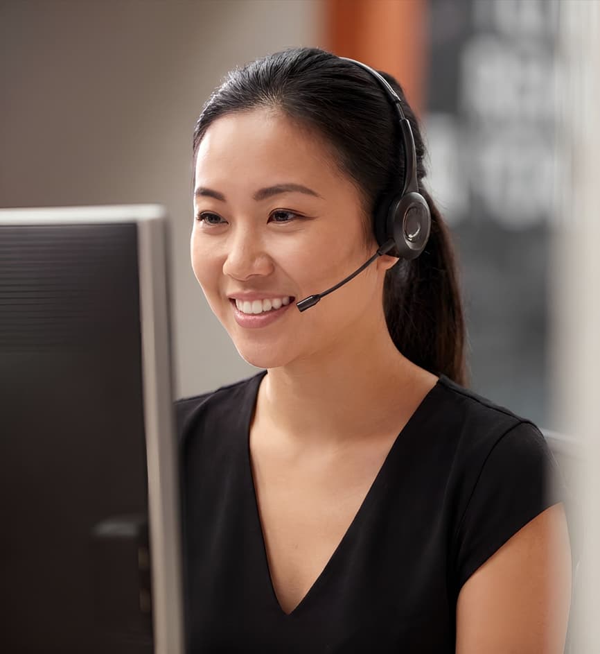 Asian content moderator smiling — Business process outsourcing & offshore staffing | Sourcefit