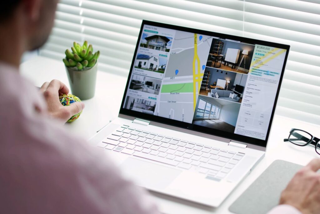 Real estate property listing viewed on a laptop — Business process outsourcing & offshore staffing | Sourcefit