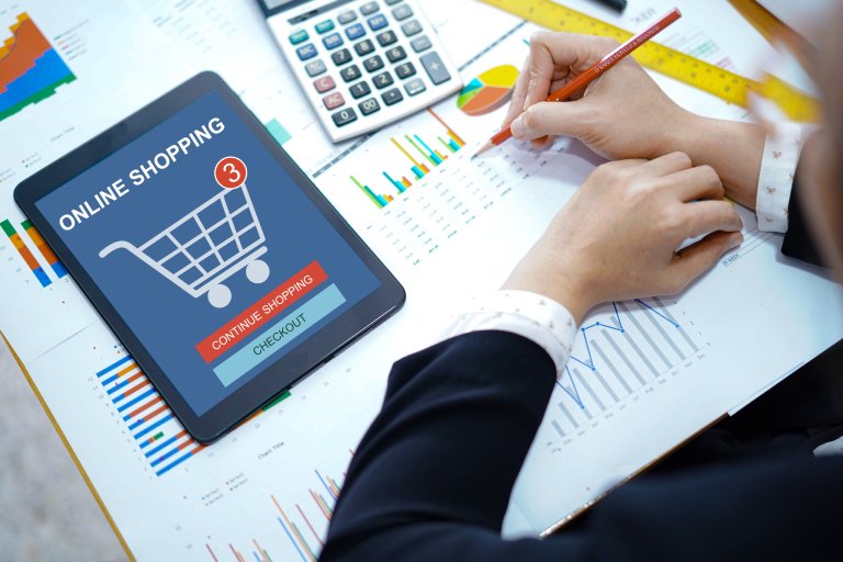 Accountant working and analyzing online shop — Business process outsourcing & offshore staffing | Sourcefit
