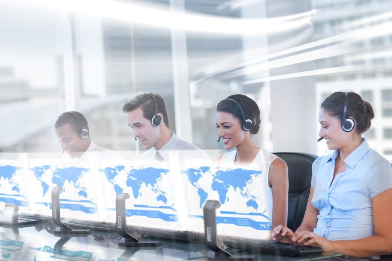 Call center employees at work on futuristic holograms in bright modern office — Business process outsourcing & offshore staffing | Sourcefit