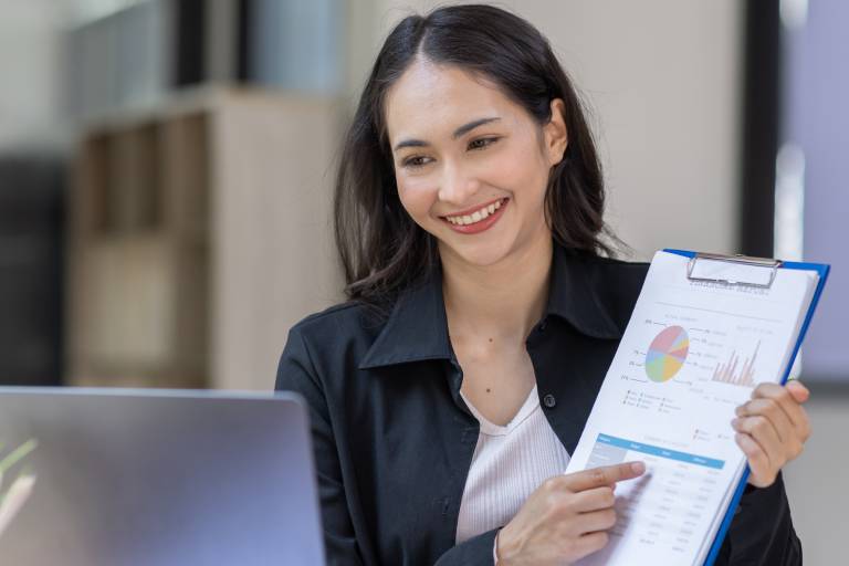Compliance analyst reviewing reports: Offshore Staffing & BPO Across 6 Countries