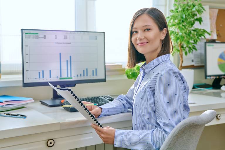 Back-office support agent at computer: Offshore Staffing & BPO Across 6 Countries