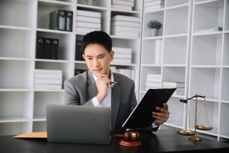 Legal researcher analyzing case law documents: Offshore Staffing & BPO Across 6 Countries