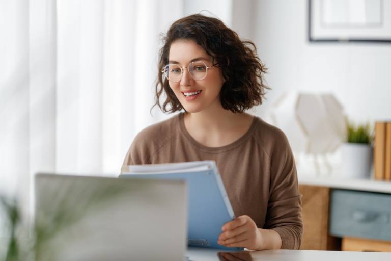 Underwriting support analyst at desk: Offshore Staffing & BPO Across 6 Countries