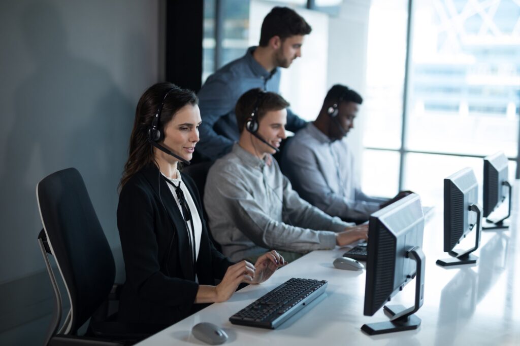 Startup team collaborating together at office desk: Offshore Staffing & BPO Across 6 Countries