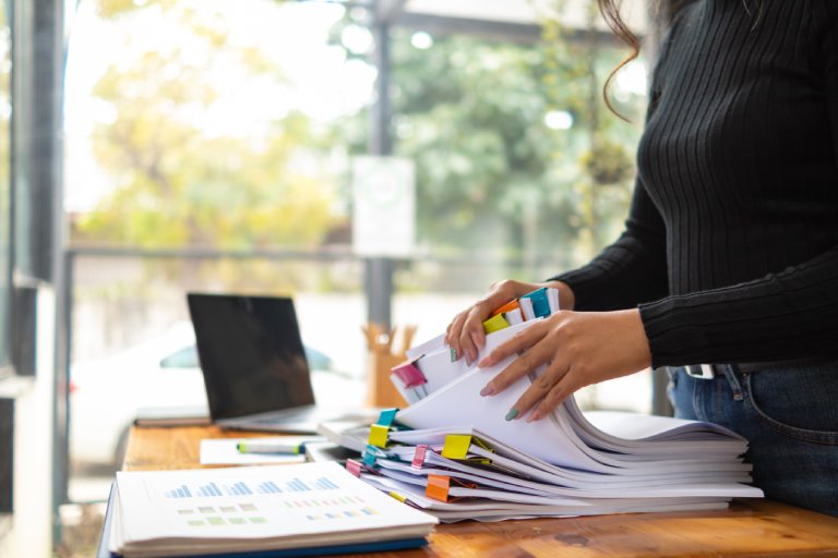Back-office admin sorting documents: Offshore Staffing & BPO Across 6 Countries