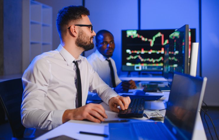 Finance analysts reviewing market data: Offshore Staffing & BPO Across 6 Countries