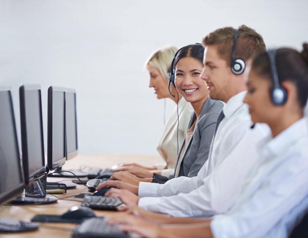 Offshore support team collaborating with headsets at desks: Offshore Staffing & BPO Across 6 Countries