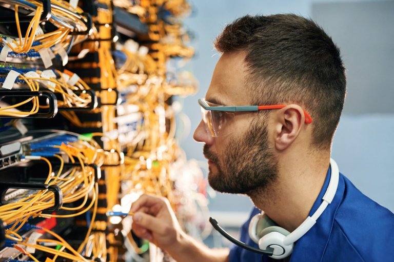 Network operations engineer inspecting infrastructure: Offshore Staffing & BPO Across 6 Countries