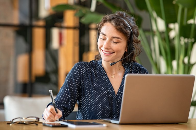 Lending specialist working on laptop: Offshore Staffing & BPO Across 6 Countries