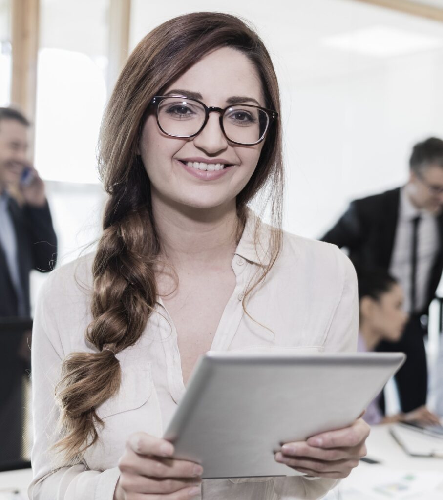 Woman holding a tablet in an office: Offshore Staffing & BPO Across 6 Countries