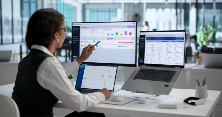 Hand pointing at supply chain dashboard screen: Offshore Staffing & BPO Across 6 Countries